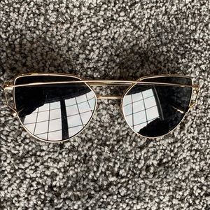 Gold framed black sunglasses